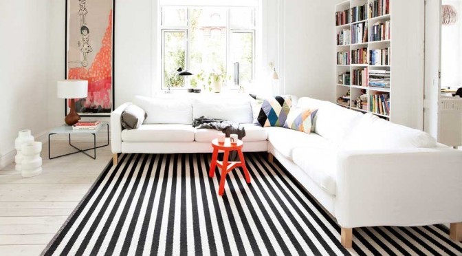 Living Room floor with stripe rug.
